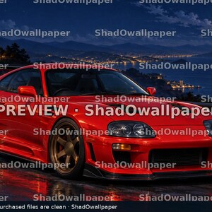 May include: A bright red sports car with bronze-colored wheels parked on a wet coastal road at night under a full moon. The car features a low front bumper, a rear spoiler, and dark headlights. The text PREVIEW Shadowallpaper is visible.