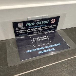May include: A Pro-Catch professional mouse and insect glue trap with a black and white design. The trap features text including 'Super Sticky Glue Surface', 'Silicone Slippery Surface', and 'Professional Mouse and Insect Glue Trap' with a QR code.