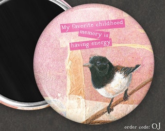 May include: A pink and white round magnet featuring a black and white bird illustration. The magnet has a quote that reads "My favourite childhood memory is having energy".