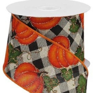 May include: A 2.5 inch wide wired ribbon with a black and white buffalo check pattern and orange pumpkins with green leaves. The ribbon has a gold glitter accent.