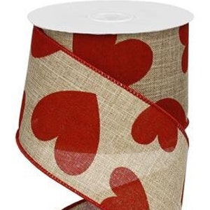 May include: A roll of burlap ribbon with red hearts printed on it. The ribbon is 2.5 inches wide and has a wired edge.
