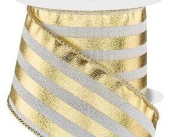 May include: A spool of decorative ribbon with a gold and silver striped pattern. The ribbon is wound around a white cardboard core. The edges of the ribbon are finished with a gold trim. This ribbon is suitable for gift wrapping and crafting.