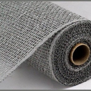 May include: A roll of gray burlap mesh ribbon. The ribbon is woven with a loose, open weave and has a slightly textured surface.