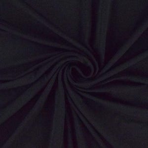 May include: A close-up of a dark blue fabric with a soft, smooth texture. The fabric is draped and folded, creating a swirling pattern.