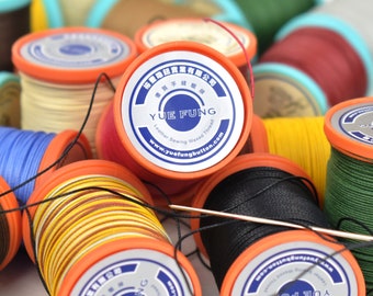 May include: Assortment of colorful spools of waxed thread for leather sewing. The spools are labeled "YUE FUNG Leather Sewing Waxed Thread" and include the website address "www.yuefungbutton.com".