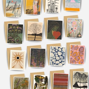 May include: A collection of art greeting cards with various illustrations. The cards feature diverse artwork, including landscapes, abstract designs, and botanical prints. Each card is paired with a brown envelope, creating a cohesive set.