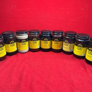 May include: Ten glass jars of Fiebing's Antique Finish leather dye in various colors, including  Saddle Brown, Fan, Neutral, British Tan, Dark Brown, Burgundy,  Agate, Cordovan, and Walnut Brown.