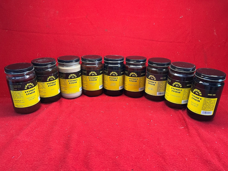 May include: Ten glass jars of Fiebing's Antique Finish leather dye in various colors, including  Saddle Brown, Fan, Neutral, British Tan, Dark Brown, Burgundy,  Agate, Cordovan, and Walnut Brown.