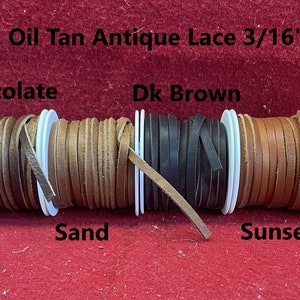 May include: Spools of leather lace in various colors, including gray, chocolate, sand, dark brown, sunset, and burgundy. The lace is 3/16 inch wide and is labeled "Oil Tan Antique Lace 3/16".