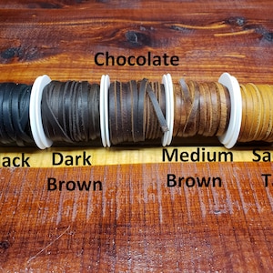 May include: Five spools of leather cord in different colors: black, dark brown, chocolate brown, medium brown, and saddle tan.