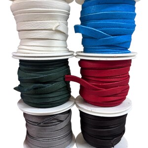 May include: Six spools of leather cord in different colors. The colors are white, blue, red, green, gray, and black.