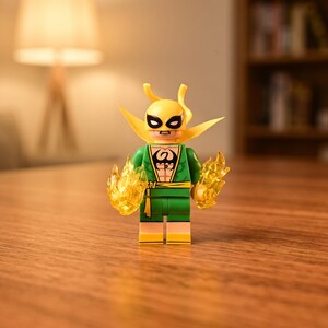 May include: A plastic minifigure character wearing a yellow mask with pointed ears, a green suit with a black dragon emblem on the chest, and a yellow belt. The figure has translucent yellow flame pieces attached to both hands.