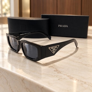 PRADA Black Rectangular Sunglasses with Gray Lenses and Gold-Tone Triangle Logo, Wide Temple Angular Eyewear with Presentation Box and Case