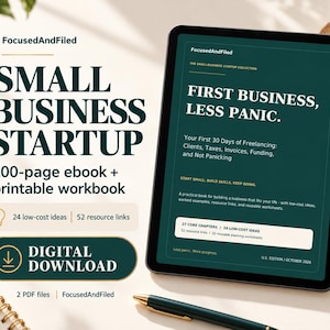 May include: A digital tablet displays a dark green ebook cover titled Small Business Startup: First Business, Less Panic. The screen shows text about freelancing, 27 core chapters, and 20 worksheets. A digital download button is visible.