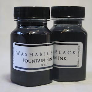 May include: Two 60 ml bottles of black washable fountain pen ink. The bottles are labeled "Washable Black Fountain Pen Ink" and "Scribal Workshop".