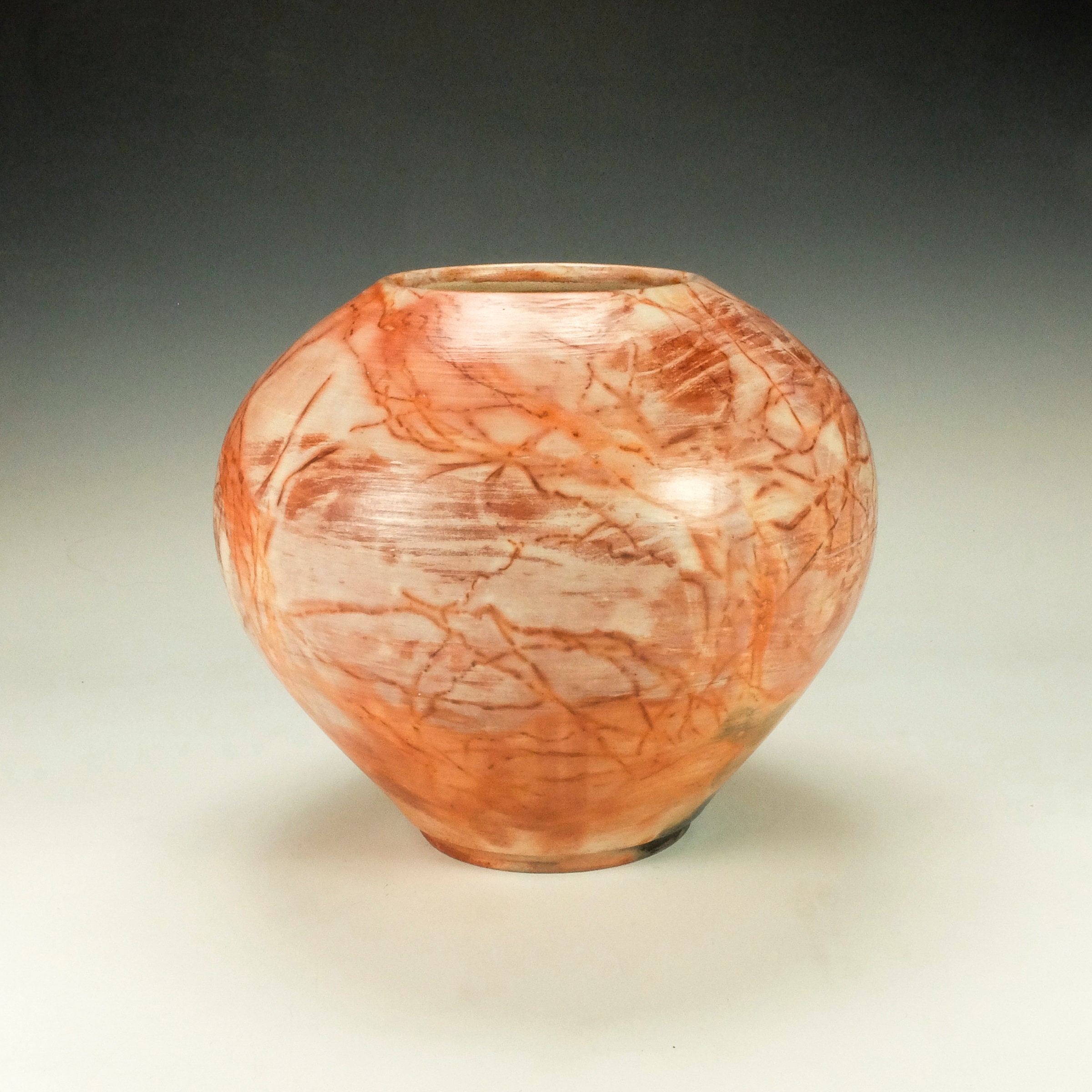 Raku Pottery, saggar fired.  Terra Sigillata, hand polished.