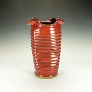 Handmade pottery vessel.  Copper red glaze.
