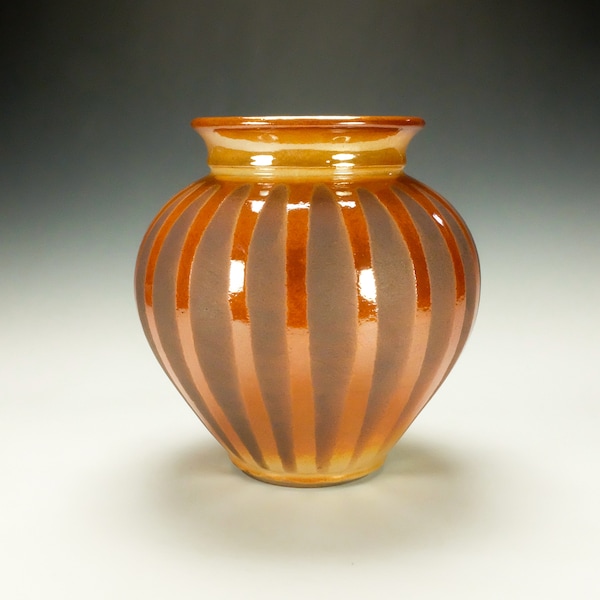 Raku Pottery with striped crackle glaze. Orange and brown.