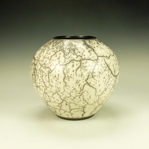 Naked Raku Pottery.  Soft light green with reddish blush