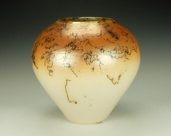 Raku Pottery with horsehair.  Terra Sigillata, hand polished.