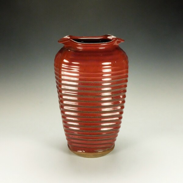 Handmade pottery vessel.  Copper red glaze.