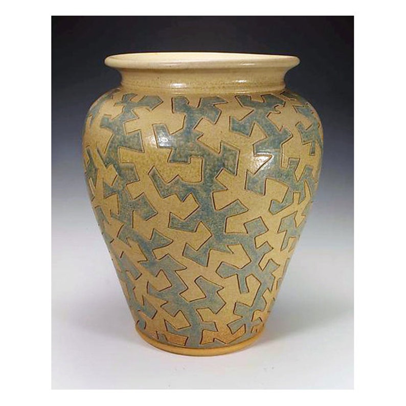 Tin Glazed Pottery Crossword Clue