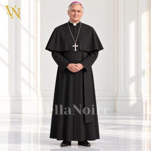 May include: A black cassock with a matching shoulder cape, featuring a row of small buttons down the front, a wide waistband, and a silver cross pendant on a chain. The garment is worn with a small magenta skullcap on the head.