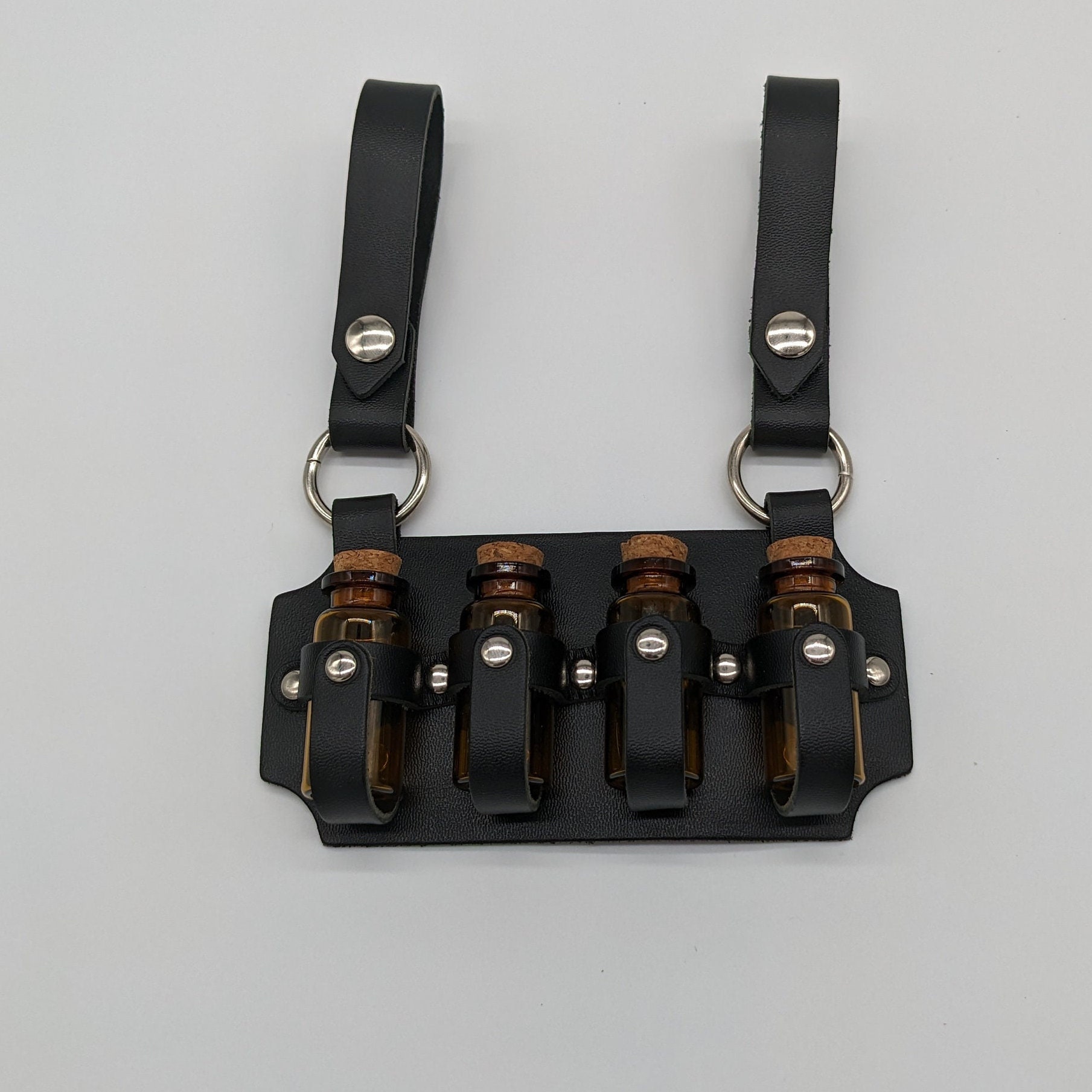 Vierfach-Fläschchenholster aus Leder
