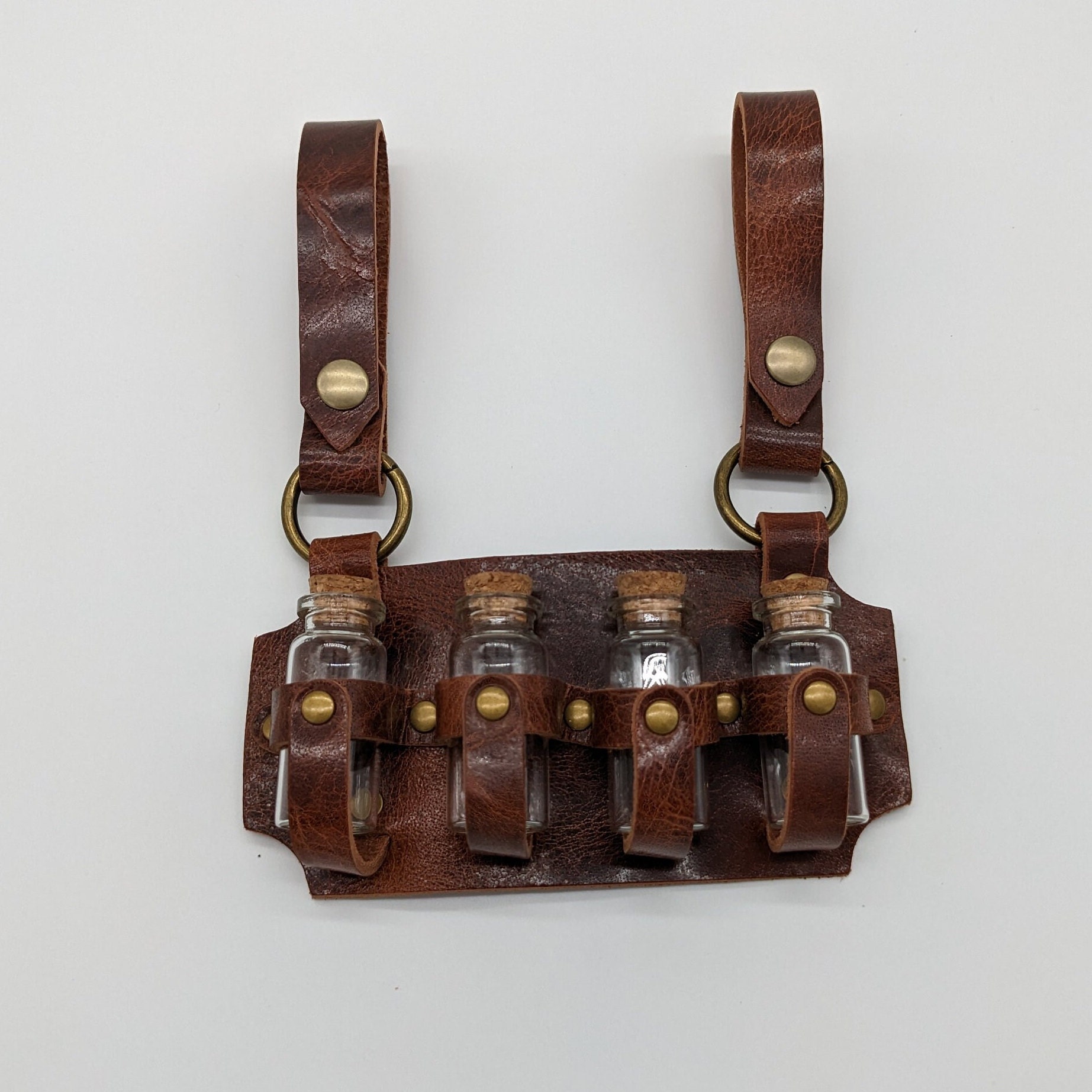 Vierfach-Fläschchenholster aus Leder