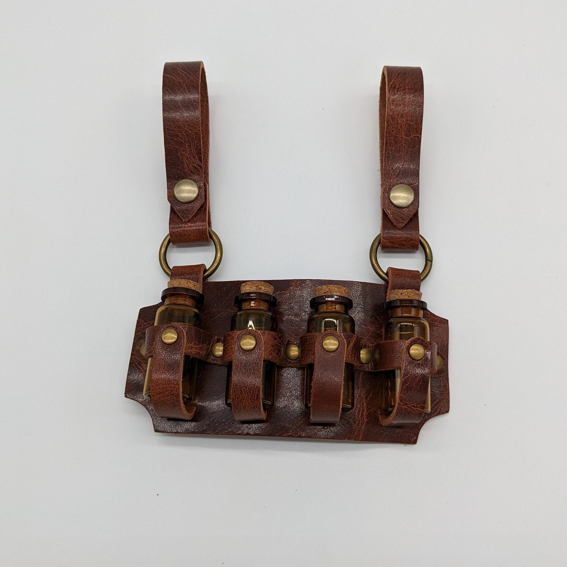 Vierfach-Fläschchenholster aus Leder