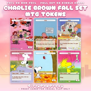 May include: A set of six Charlie Brown fall-themed MTG tokens featuring characters like Snoopy and Woodstock. The cards display various game text, including 'Human', 'Clue', 'Food', 'Treasure', 'Dog', and 'Bird'. The top text reads 'Charlie Brown Fall Set MTG Tokens' and the bottom text reads 'GirlyPopProxy'.
