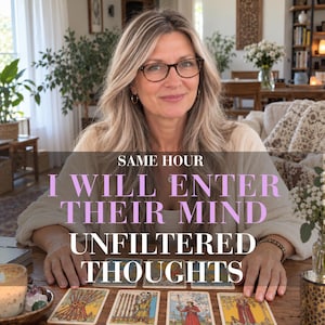 May include: A person with blonde hair and glasses sits behind a wooden table with tarot cards laid out. The text overlay reads: SAME HOUR I WILL ENTER THEIR MIND UNFILTERED THOUGHTS. The cards feature various illustrations including figures and symbols.