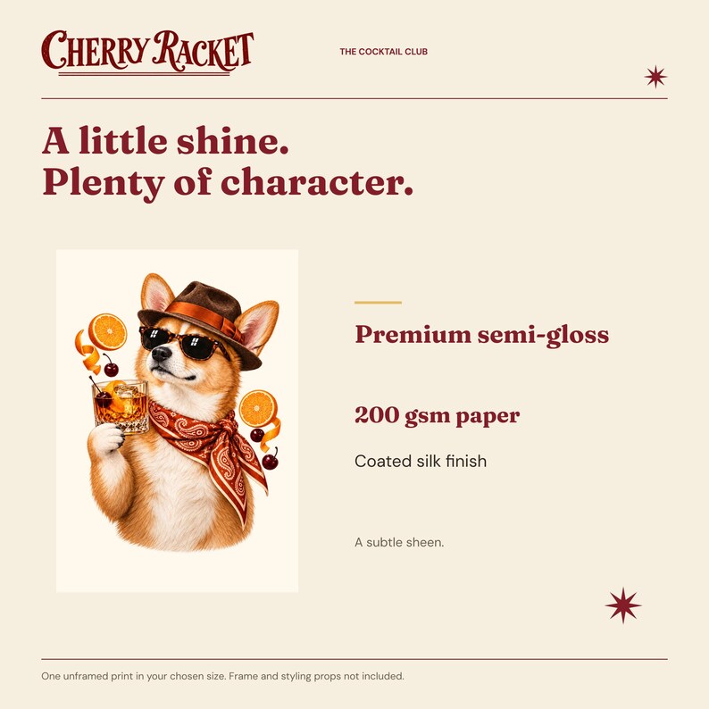 May include: A print featuring a dog wearing a brown fedora, sunglasses, and a red paisley bandana, holding a cocktail with orange slices and cherries. Text reads Cherry Racket, The Cocktail Club, A little shine. Plenty of character. Premium semi-gloss 200 gsm paper.