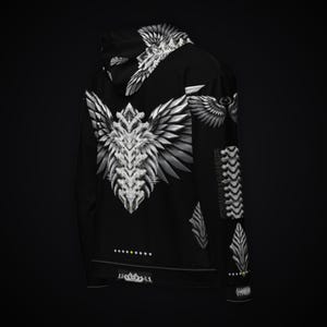 May include: A black hoodie featuring a large, white, symmetrical wing-like graphic on the back. The design includes intricate, sharp, feather-like patterns extending from a central spine. Additional wing motifs appear on the hood and sleeve.