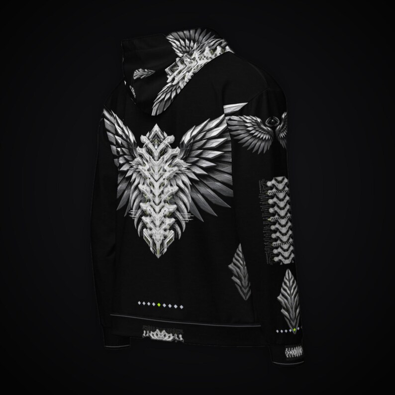May include: A black hoodie featuring a large, white, symmetrical wing-like graphic on the back. The design includes intricate, sharp, feather-like patterns extending from a central spine. Additional wing motifs appear on the hood and sleeve.