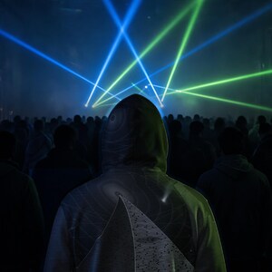 May include: A hooded sweatshirt featuring a graphic print of a pyramid with horizontal lines and circular patterns on the back. The garment is worn in a dark environment illuminated by bright blue and green laser light beams shining from above.