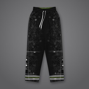 May include: Black sweatpants featuring a white circuit board pattern on the legs, a white drawstring at the elastic waistband, and horizontal white and neon green striped detailing along the bottom hem of each pant leg.