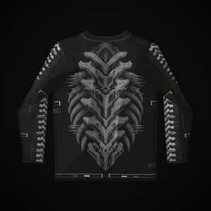 May include: A black long-sleeve shirt featuring a central gray, mechanical, rib-like graphic design. The sleeves display a repeating white spinal column pattern with small neon green accents and technical grid lines throughout the garment.