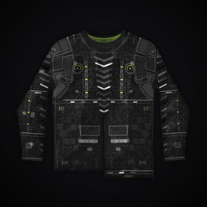 May include: A long-sleeve shirt featuring a black base with a white and neon green circuit board pattern. The design includes a central column of white chevron shapes, two circular accents on the chest, and grid-like technical line details.