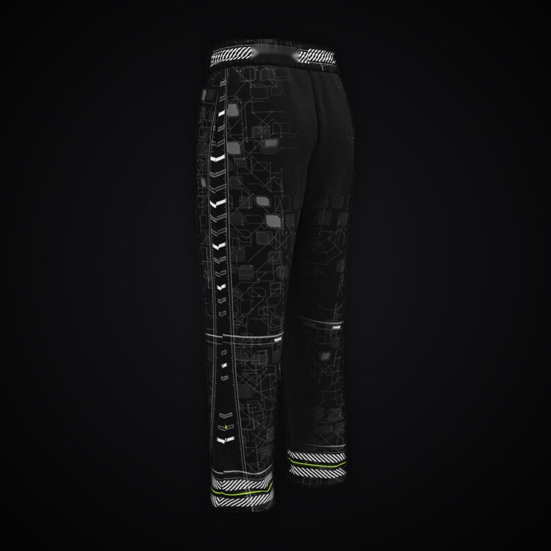 May include: Black sweatpants featuring a white and grey geometric circuit-like pattern across the fabric. The trousers include a vertical side stripe with white chevron accents and horizontal striped detailing at the elasticated waistband and cuffs.