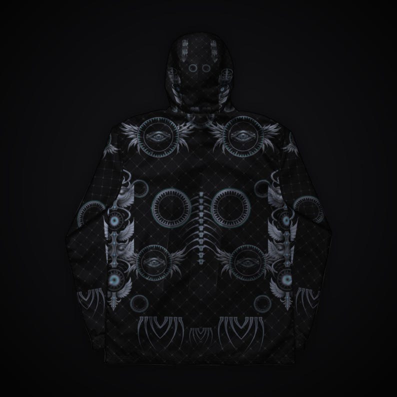 May include: A black hooded jacket featuring a repeating pattern of grey circular eye motifs, winged symbols, and a central spinal column graphic. The fabric has a subtle diamond grid texture throughout the entire garment surface.