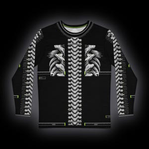 May include: A black long-sleeve shirt featuring a white mechanical spine and rib cage graphic down the center and along the sleeves. The design includes small neon green accents and technical grid patterns, with a round neckline.