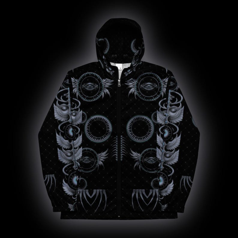 May include: A black zip-up hoodie featuring a repeating pattern of grey winged eyes, circular gear-like motifs, and subtle dotted textures. The garment includes a hood, a full-length front zipper, and long sleeves, with the graphic design covering the entire surface.