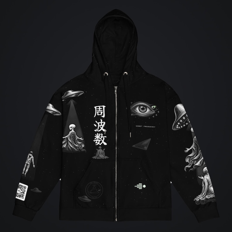 May include: A black zip-up hoodie featuring a white graphic print of extraterrestrial figures, flying saucers, a large eye, and the Japanese characters 周波数. The design includes a QR code on the sleeve and a small geometric symbol on the front.