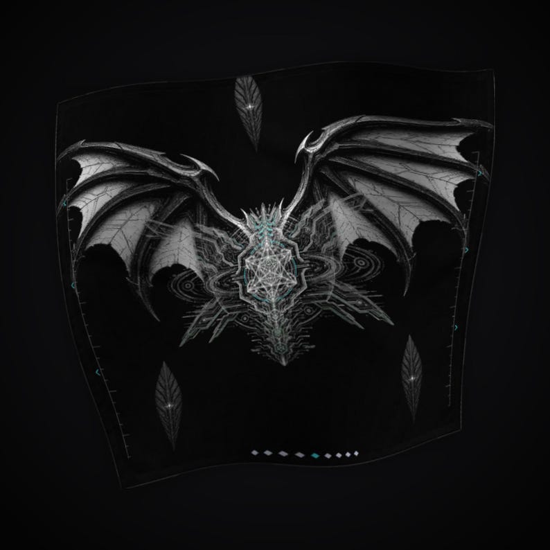 May include: A black fabric square featuring a detailed white graphic of large, spread dragon wings centered above a complex geometric star pattern. Three small, pointed leaf-like shapes are positioned around the central design.
