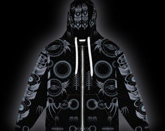 May include: A black zip-up hoodie featuring a repeating pattern of white and light gray graphic elements, including winged eyes, circular gears, and geometric symbols. The garment includes a hood with white drawstrings and a full-length front zipper.