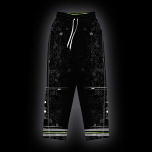 May include: Black sweatpants featuring a white geometric circuit-like pattern, a lime green inner waistband, and white drawstring cords. The lower legs display horizontal white striped detailing with a lime green accent line above the hem.