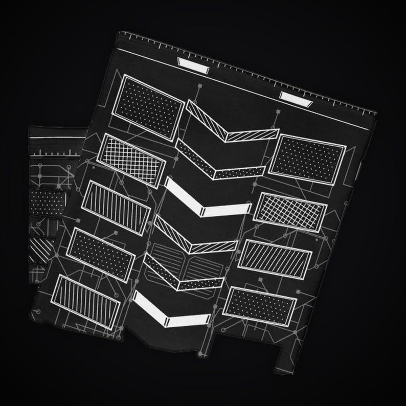 May include: A black rectangular sheet featuring a white technical blueprint design. The pattern includes various geometric shapes, including rectangles with dot and cross-hatch textures, and a central column of stacked chevron arrows.