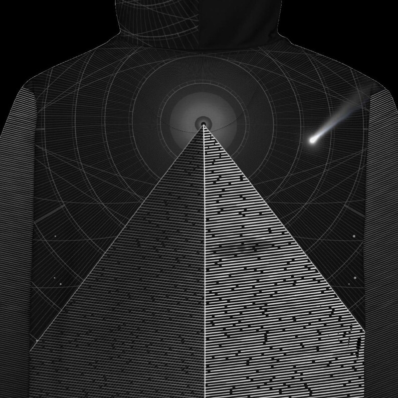 May include: A black hoodie featuring a graphic print of a large pyramid centered against a dark background with concentric circular lines. A bright white comet streaks across the upper right side, and the pyramid surface displays a pattern of horizontal white lines.