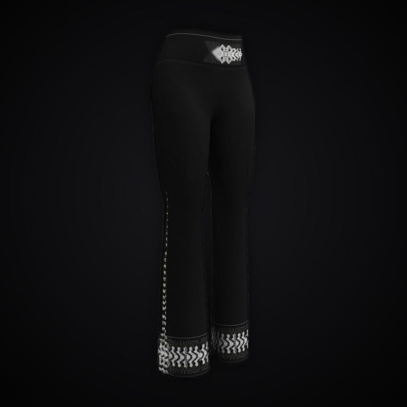 May include: Black leggings featuring a high waistband with a white geometric pattern. The same white pattern runs vertically down the outer side of the right leg and encircles the bottom hem of both legs, creating a cohesive design.